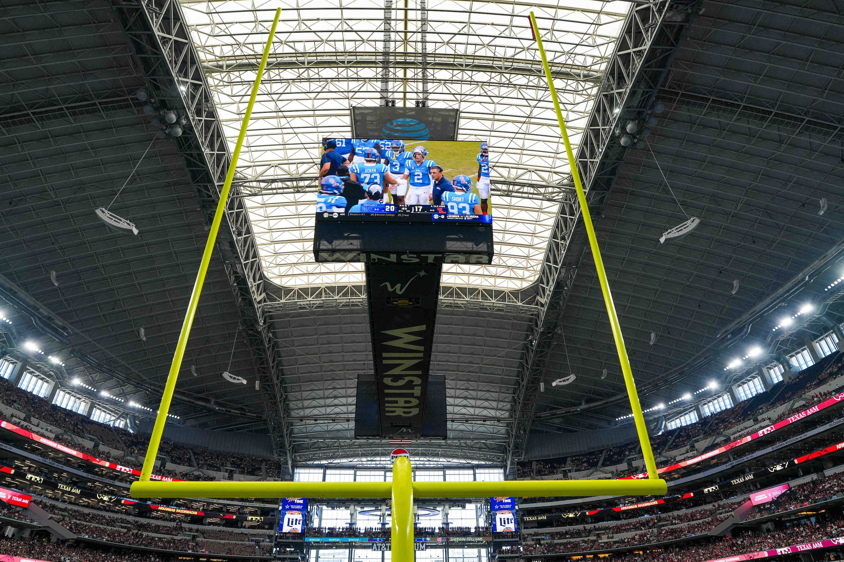 Fhe Kentucky upset of Ole Miss is played on the stadium screens before an NCAA football game...