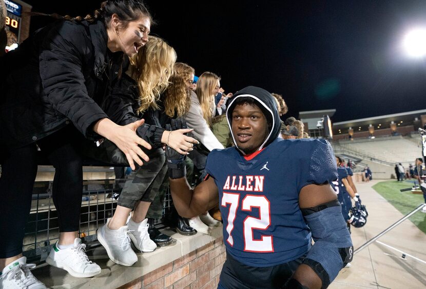 Allen senior offensive lineman Neto Umeozulu (72) celebrates with fans after his team’s...