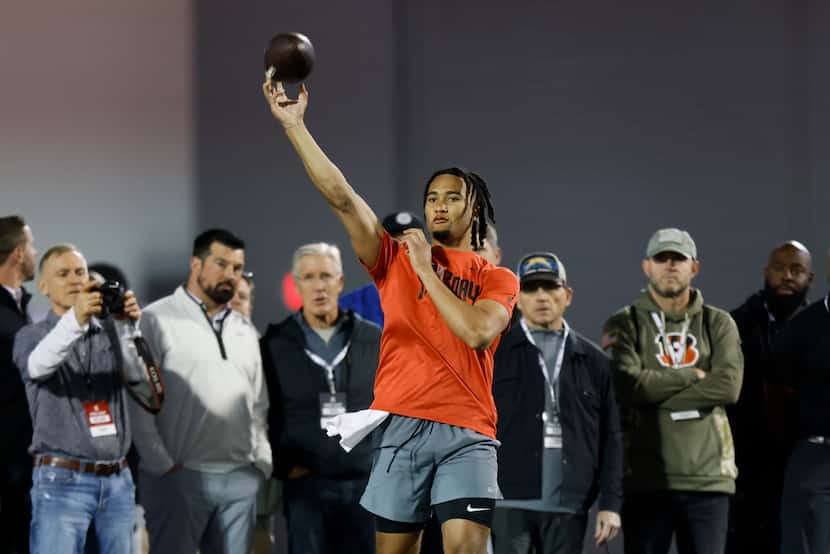 Ohio State football quarterback C.J. Stroud runs a drill at the school's NFL Pro Day in...