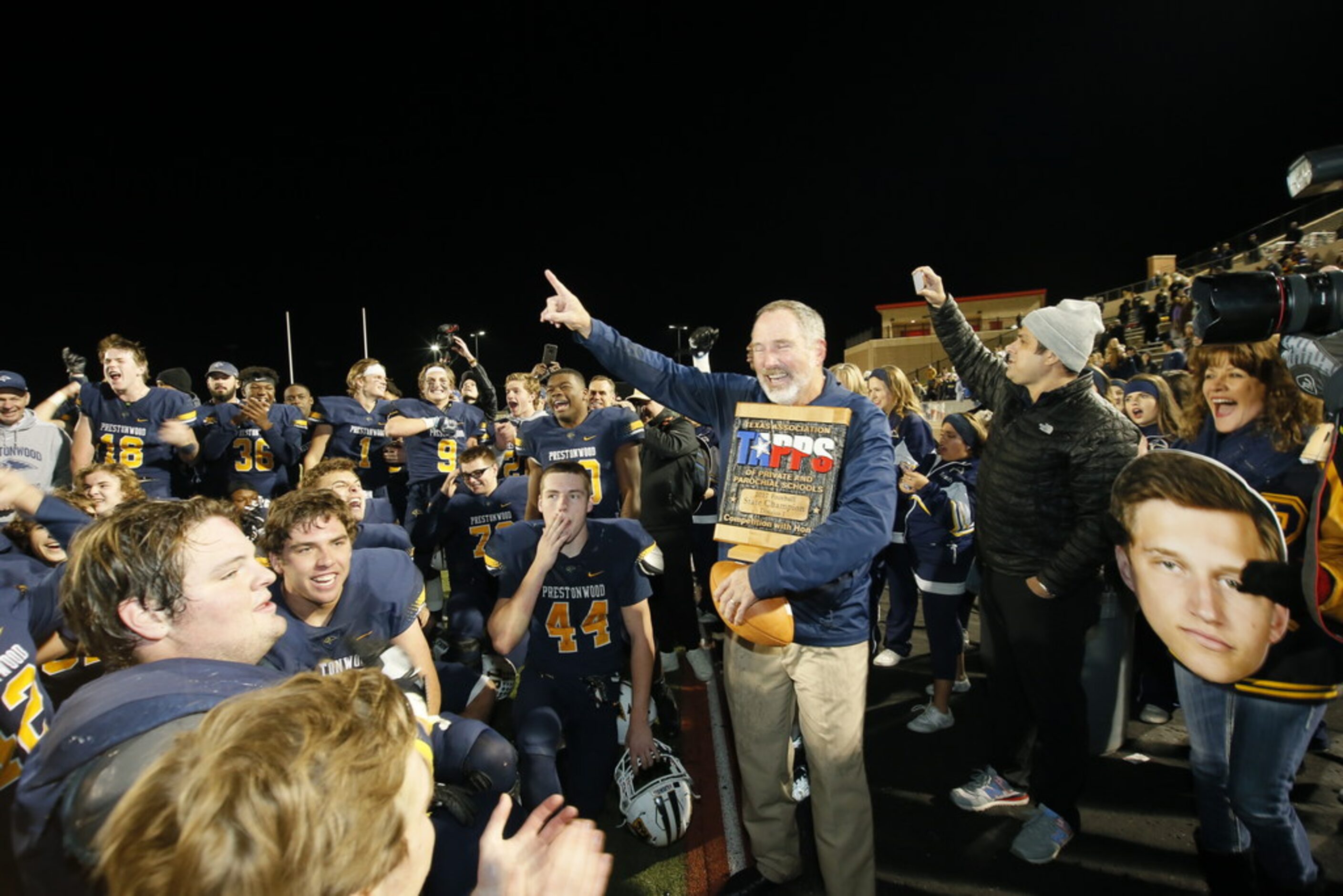 Prestonwood Christian Academy Head coach Chris Cunningham  celebrates after winning the...