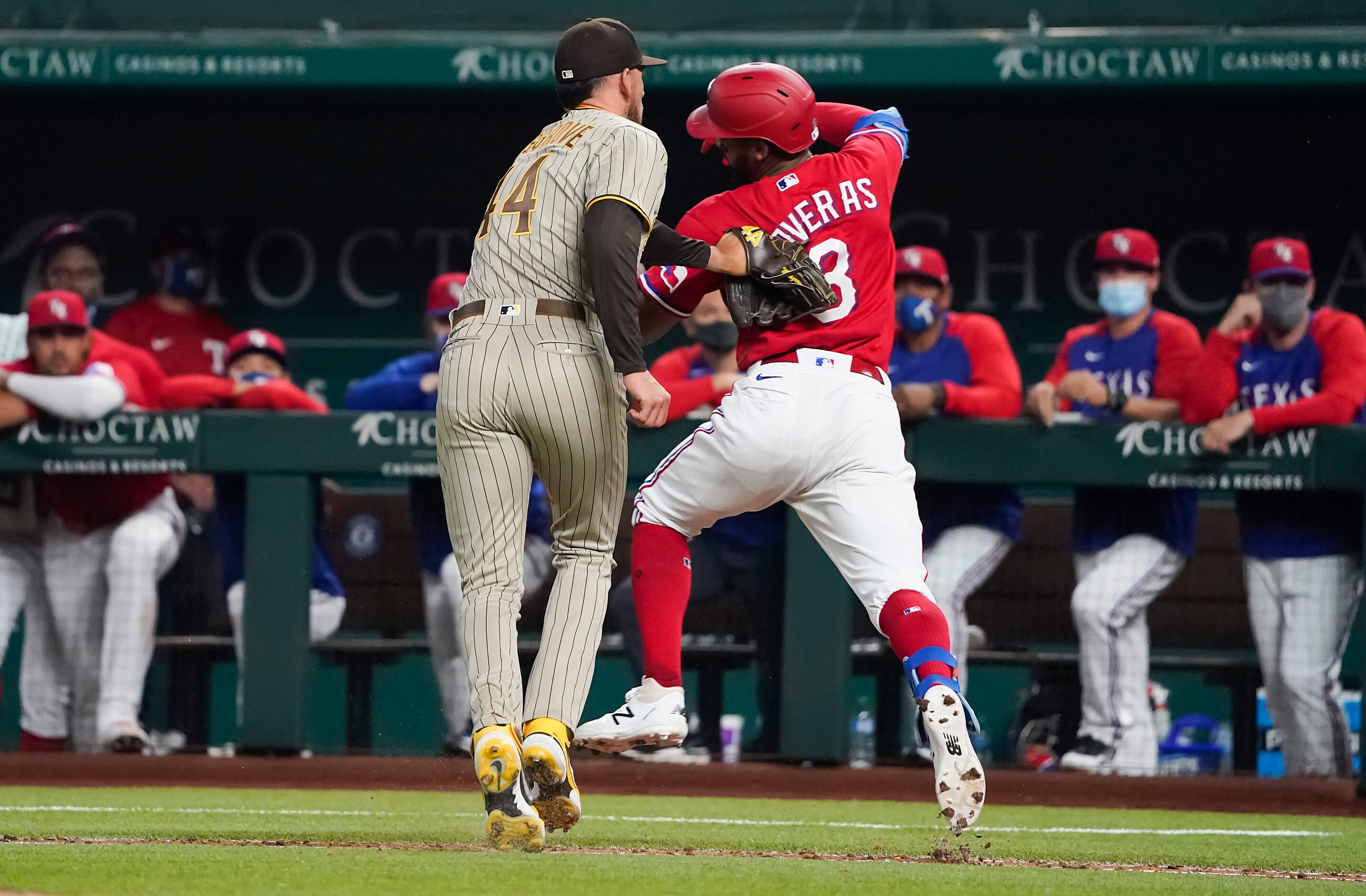 San Diego Padres starting pitcher Joe Musgrove puts a tag on Texas Rangers center fielder...