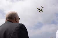 Arlington Mayor Jim Ross looks up as Aerialoop demonstrates the ALT/4/005 drone at the Bob...