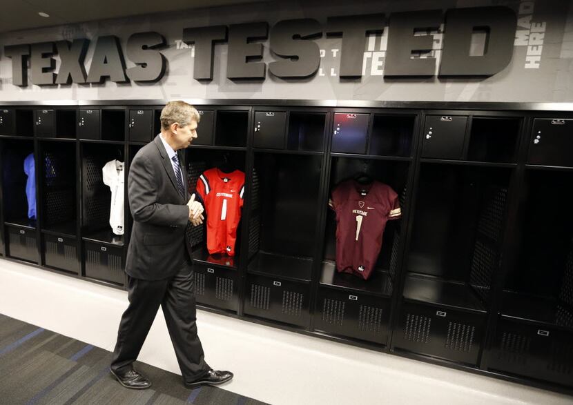 Frisco ISD Superintendent Jeremy Lyon checks out the Nike-designed locker room and uniforms...