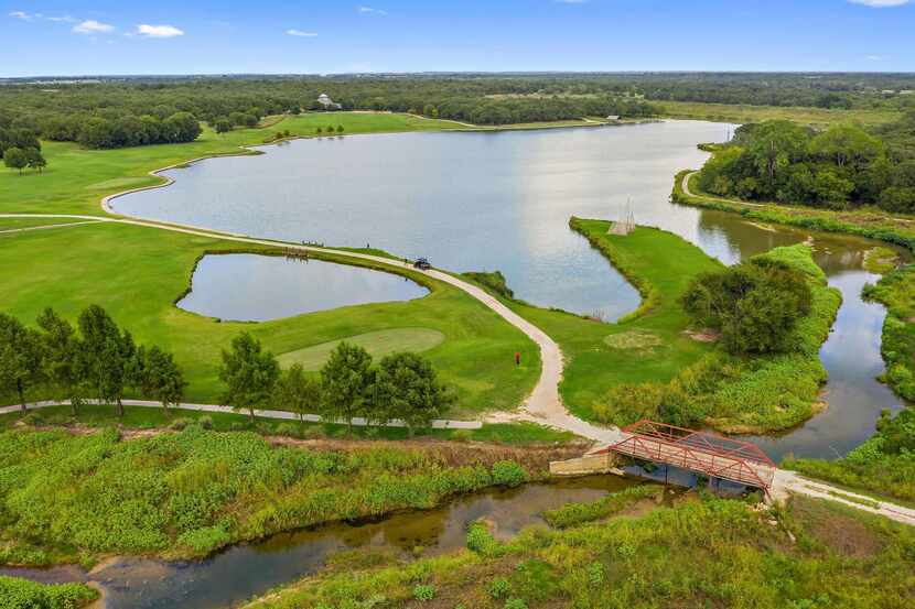 The roughly 884-acre Prairie Oaks Ranch with a nine-hole golf course and multiple lakes is...