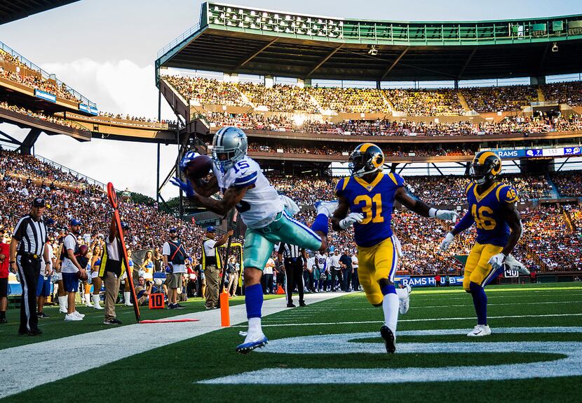 Dallas Cowboys wide receiver Devin Smith (15) catches a pass in the end zone for a touchdown...