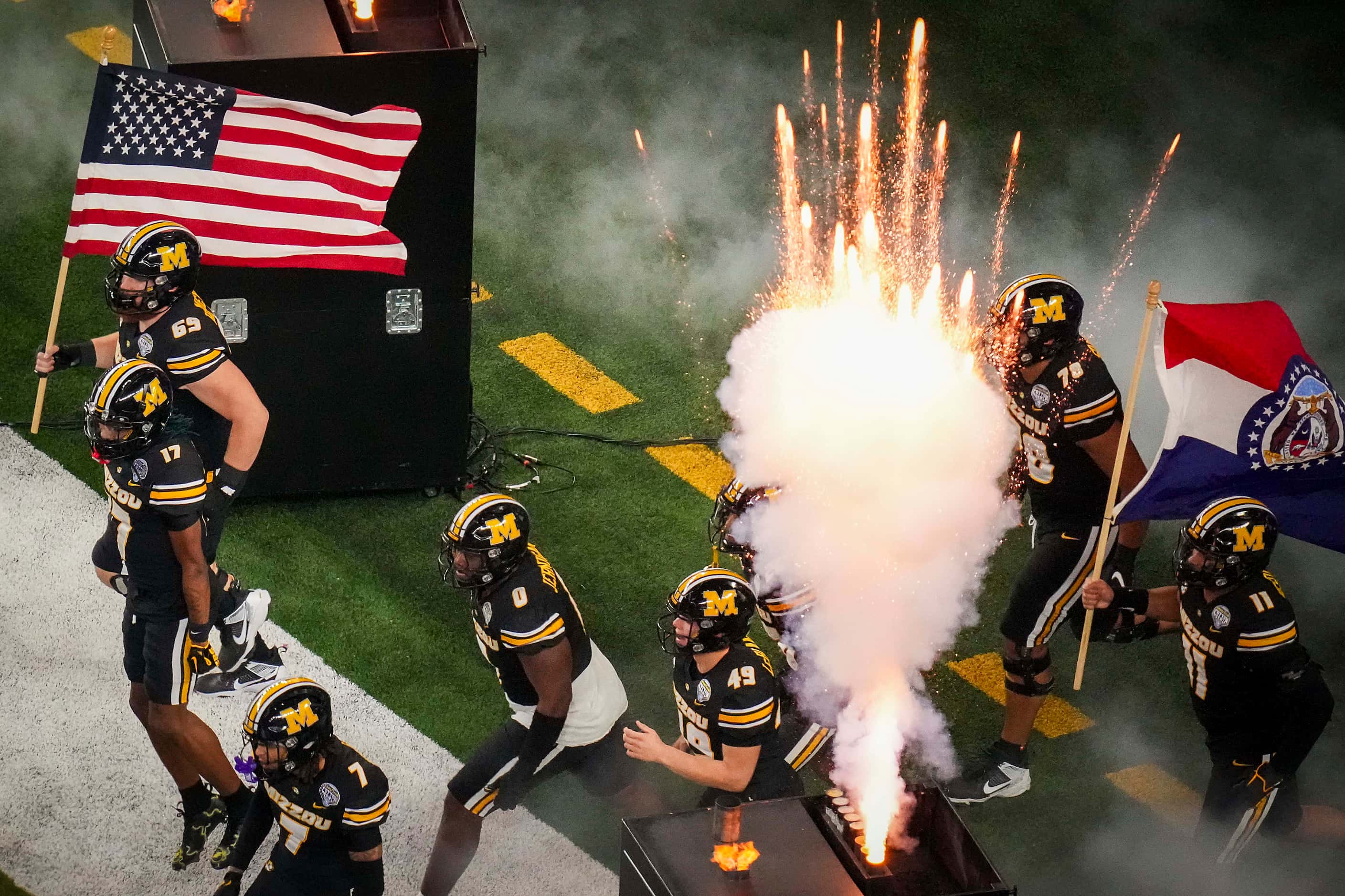 Missouri players take the field before the Goodyear Cotton Bowl Classic against Ohio State...