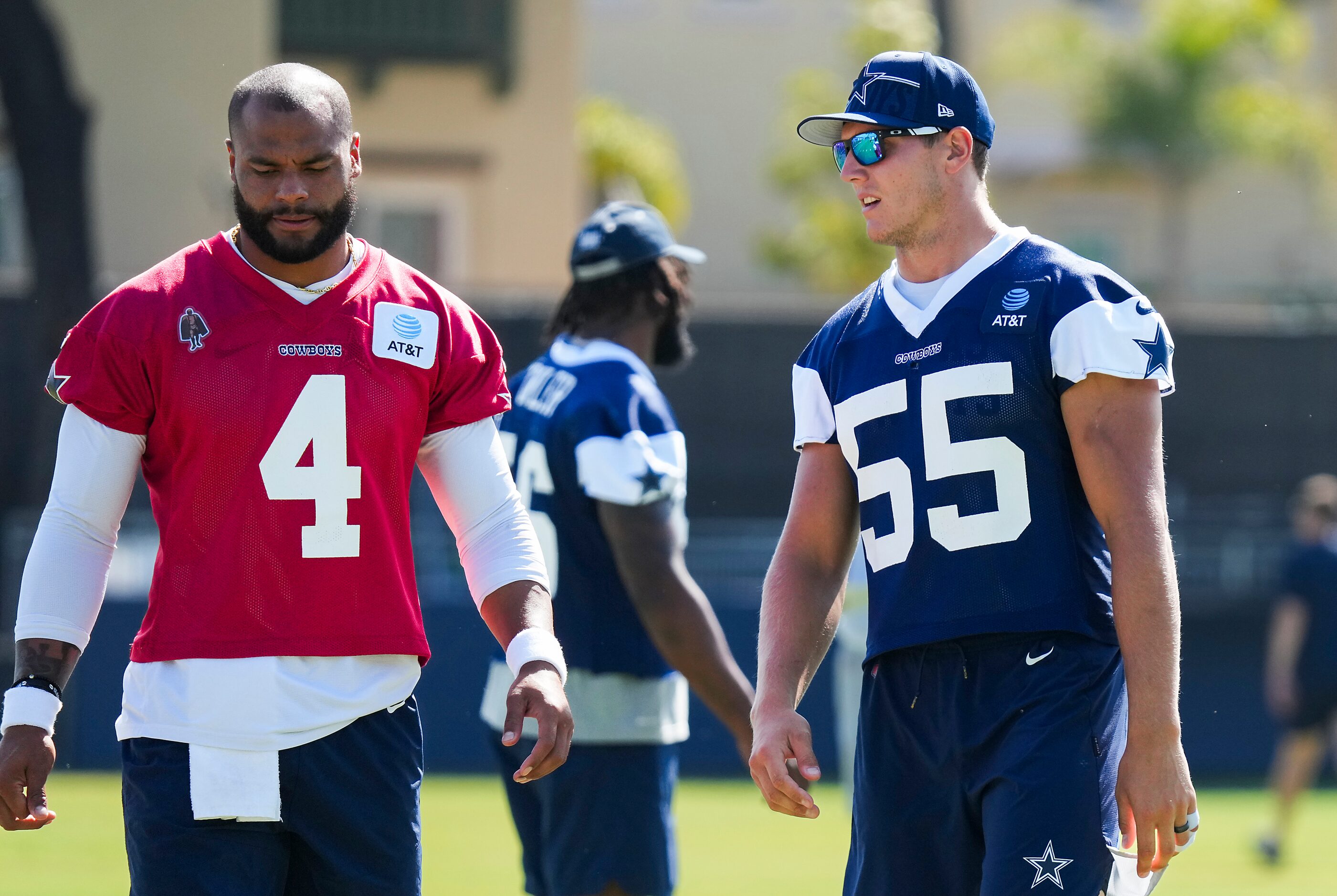 Dallas Cowboys quarterback Dak Prescott (4) talks with outside linebacker Leighton Vander...