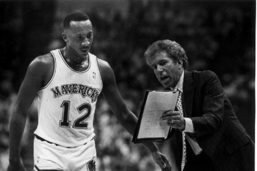 FILE - Dallas Mavericks coach John MacLeod (right) shows Derek Harper a new play.