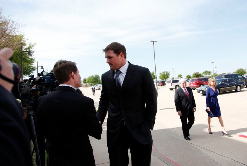 Dallas Cowboys player Jason Witten talks with members of the press before entering the...