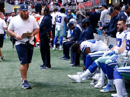 FILE - Travis Frederick walks along the sideline before a game between the Cowboys and...