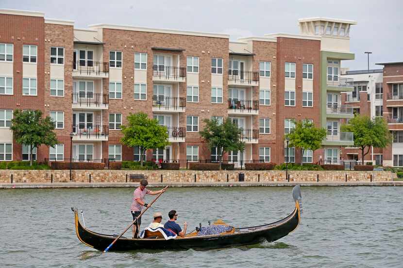 Brendan Meyer and reader Ayhan Calis ride a gondola guided by gondolier Tomy Dudley on Lake...
