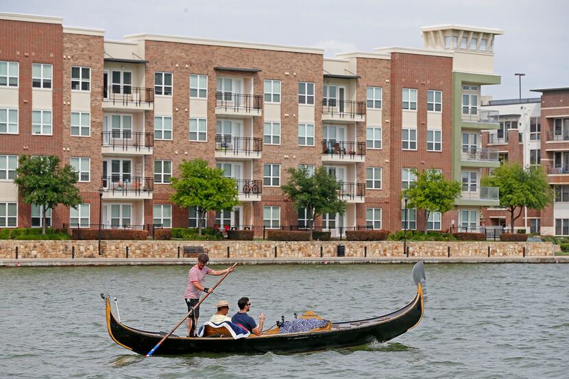 Brendan Meyer and reader Ayhan Calis ride a gondola guided by gondolier Tomy Dudley on Lake...