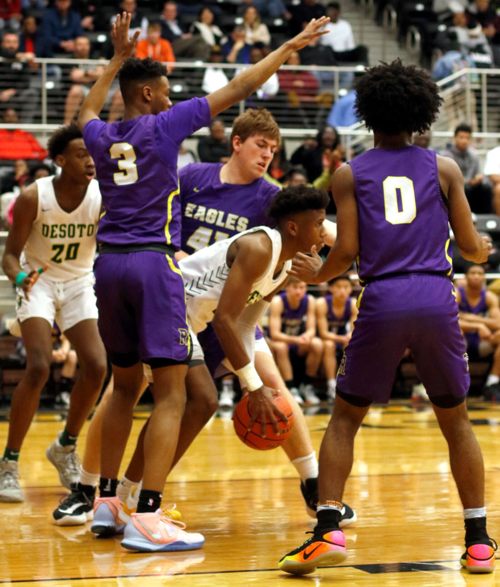 DeSoto's Jaylon Frazier-Collins (22) is trapped by the aggressive defense of Richardson...