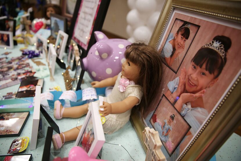 Mementos lined a table during a memorial service and viewing for Linda Rogers at Park Cities...