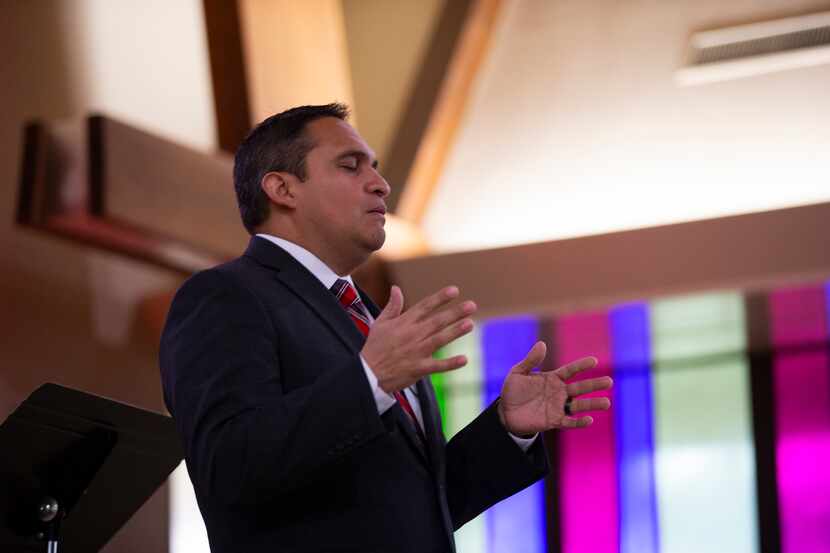 Pastor Ricardo Brambila led his congregation in prayer in First Mexican Baptist Church's new...