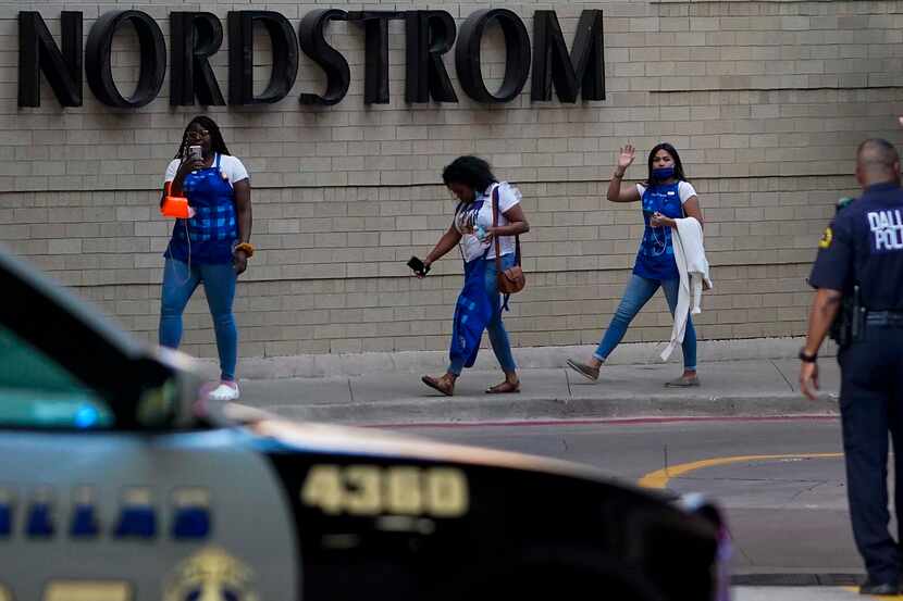 Dallas police direct people away from the Nordstrom store at the Galleria Dallas on Tuesday.