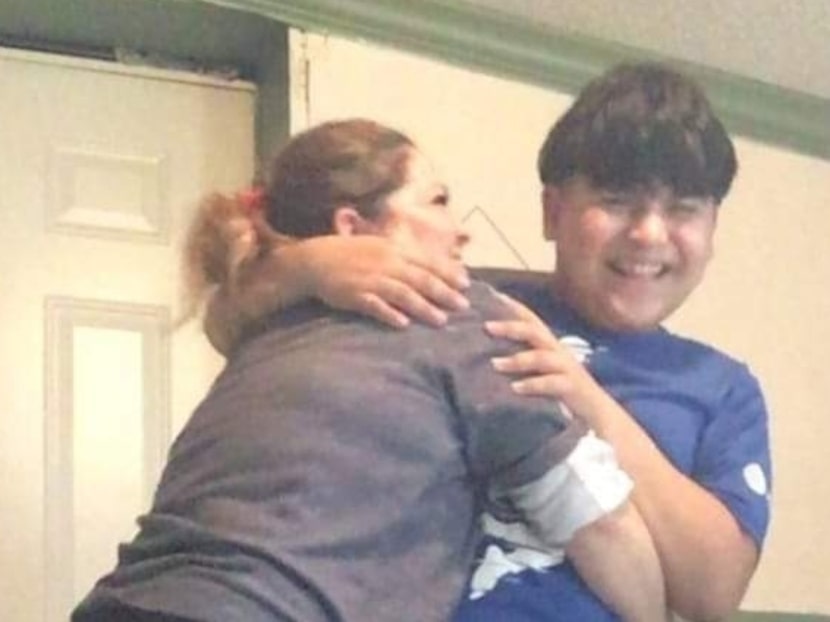 Elizabeth Benetiz hugs her son Marcos Villanueva in their home in Dallas, Texas.