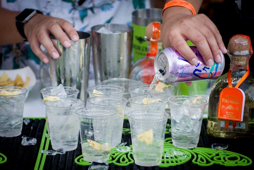 Bartender Aaron Sanchez prepares cocktails at the 2018 Chefs for Farmers festival. This...