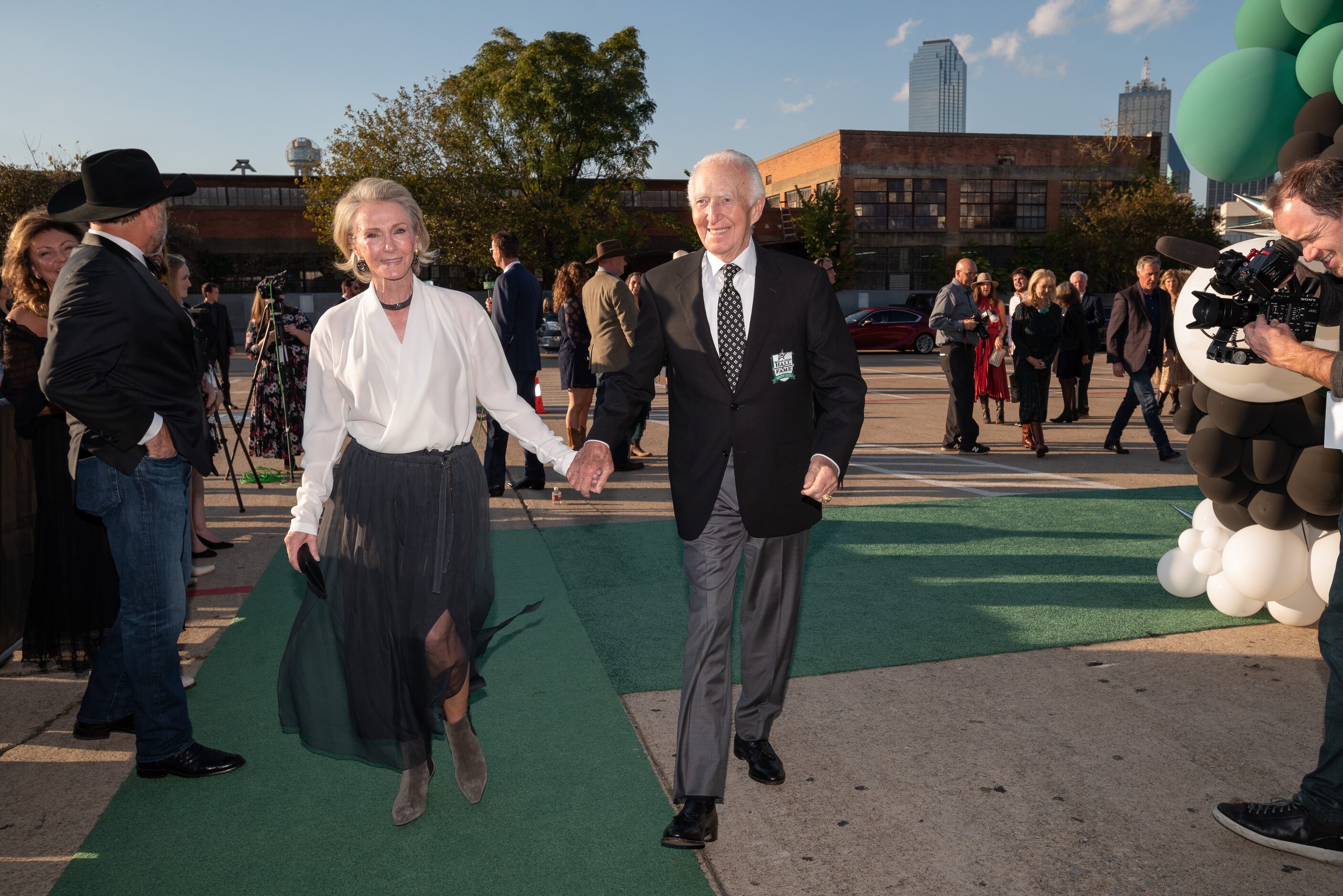 Former owner Norm Green and his wife Kelly Green, pose for photos as they arrive for the...