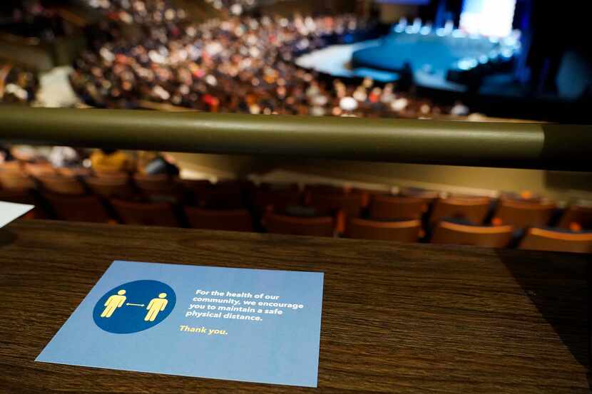 A social distancing card is seen in the upper level of Gateway Church's Dallas campus, where...