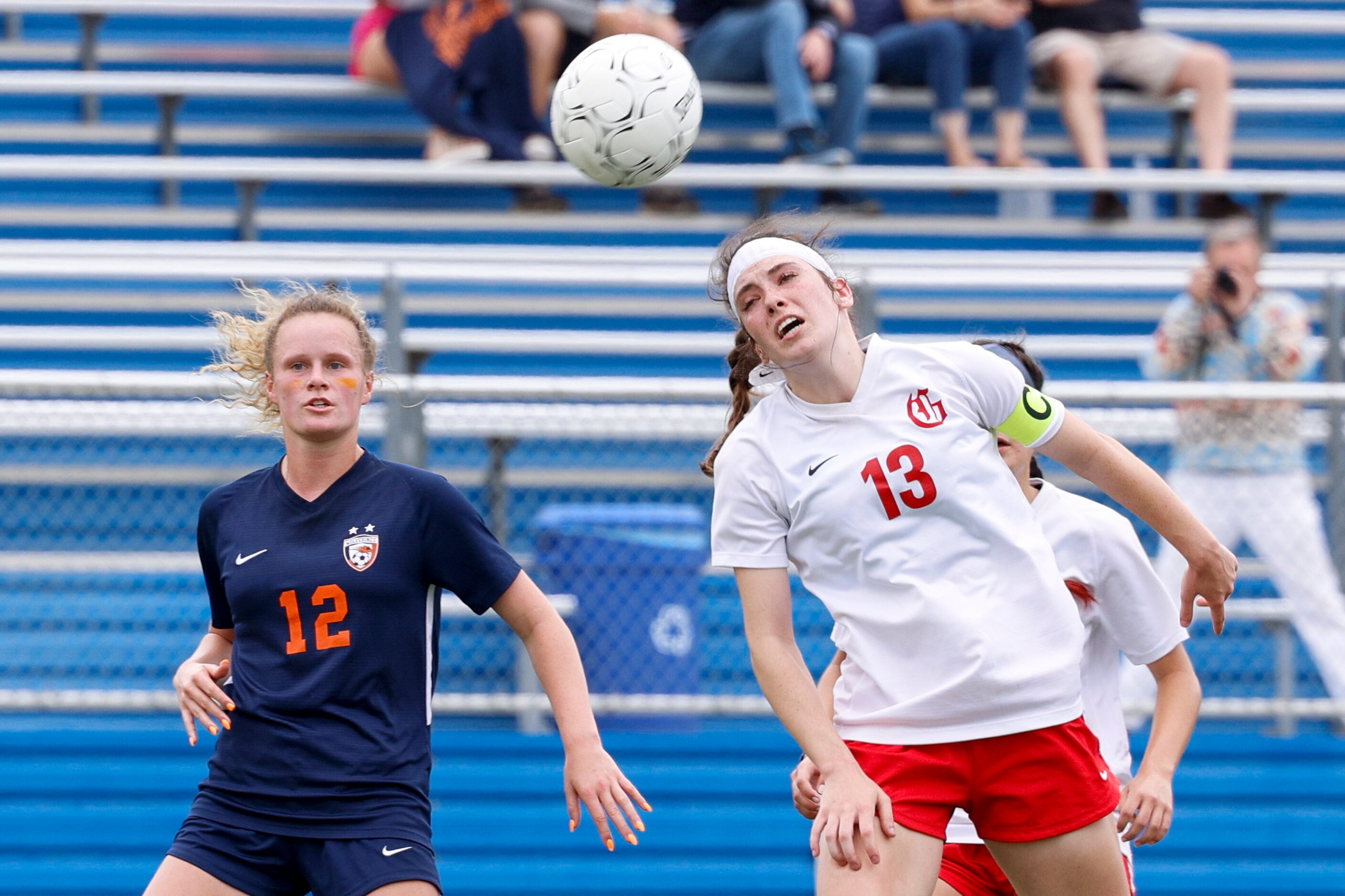 Grapevine midfielder Kasten Merrill (13) leaps for a header alongside Frisco Wakeland...