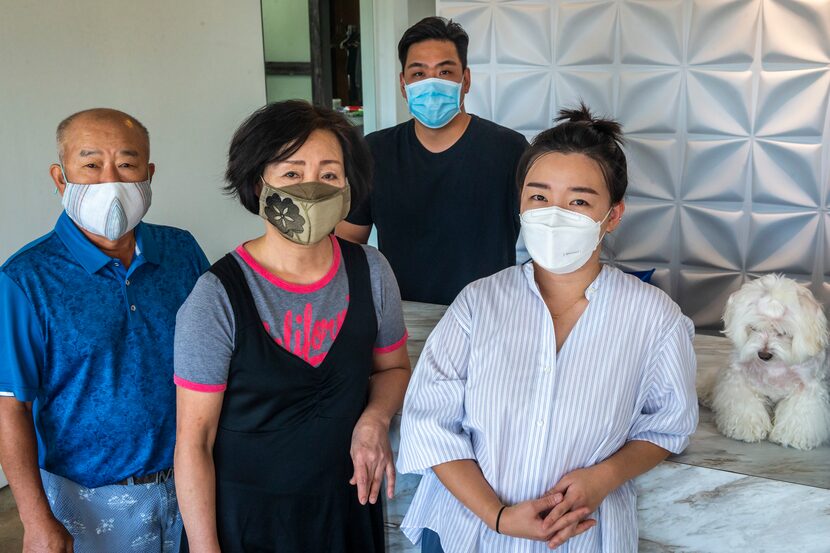 The Seok family (from left), John, Yoon, John and Reina, pose for a portrait at the Preston...