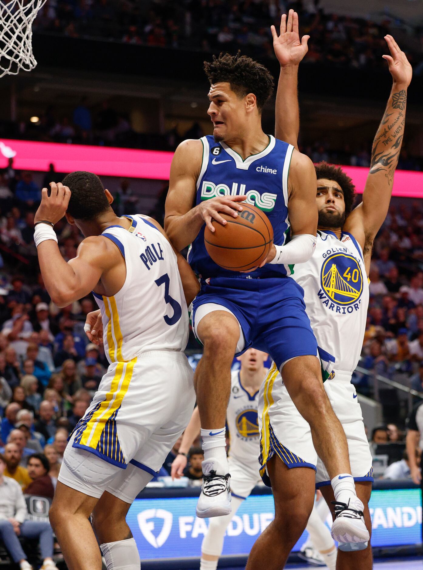 Dallas Mavericks guard Josh Green (8) spins around Golden State Warriors guard Jordan Poole...