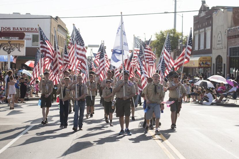 A group of Boy Scouts participates in Garland's annual Labor Day Parade. (2015 File...