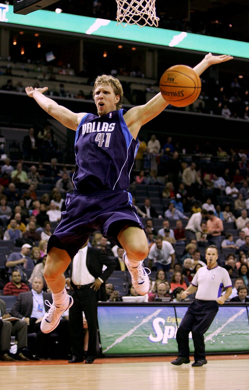 CHARLOTTE, NC - NOVEMBER 11:  Dirk Nowitzki #41 of the Dallas Mavericks reacts to being...