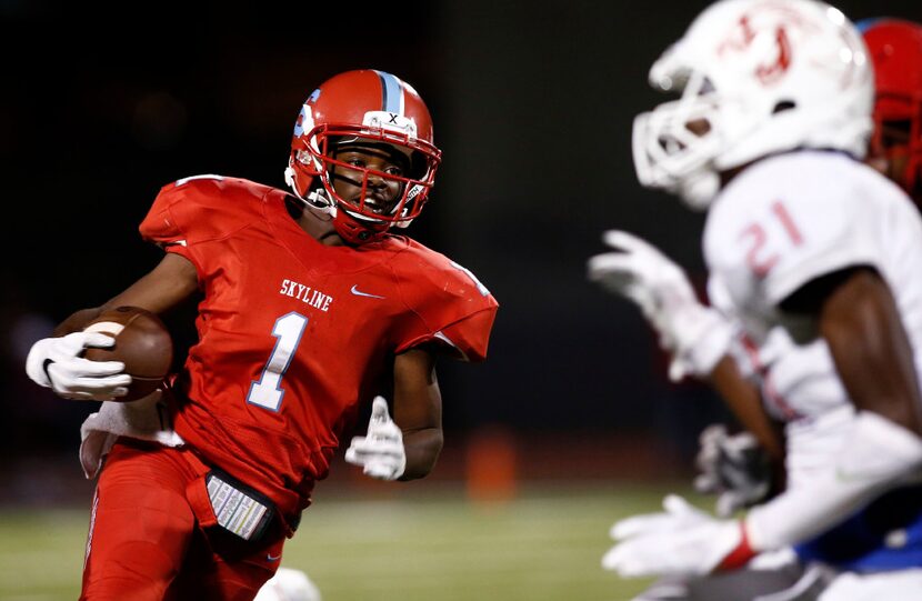 Skyline quarterback Velton Gardner (1) carries the ball against Duncanville in the second...