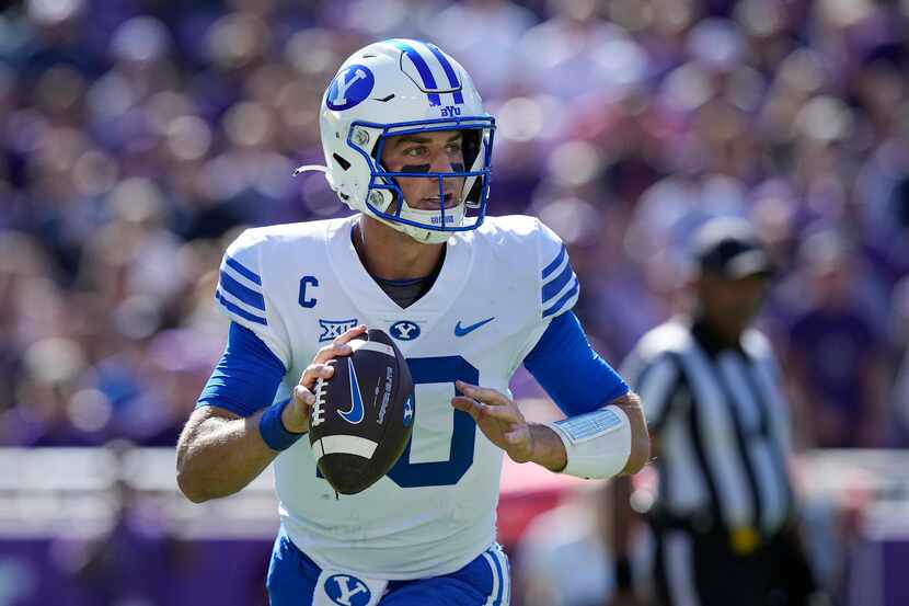 BYU quarterback Kedon Slovis (10) looks to pass during the first half of an NCAA college...