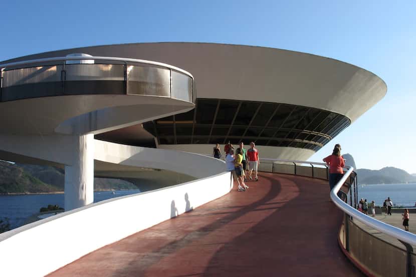 Visitors check out the distinctive Museum of Contemporary Art October 15, 2006, in Niteroi,...