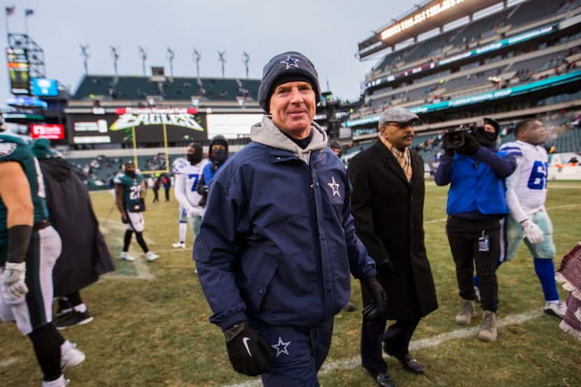 Dallas Cowboys head coach Jason Garrett walks off the field after an NFL game between the...
