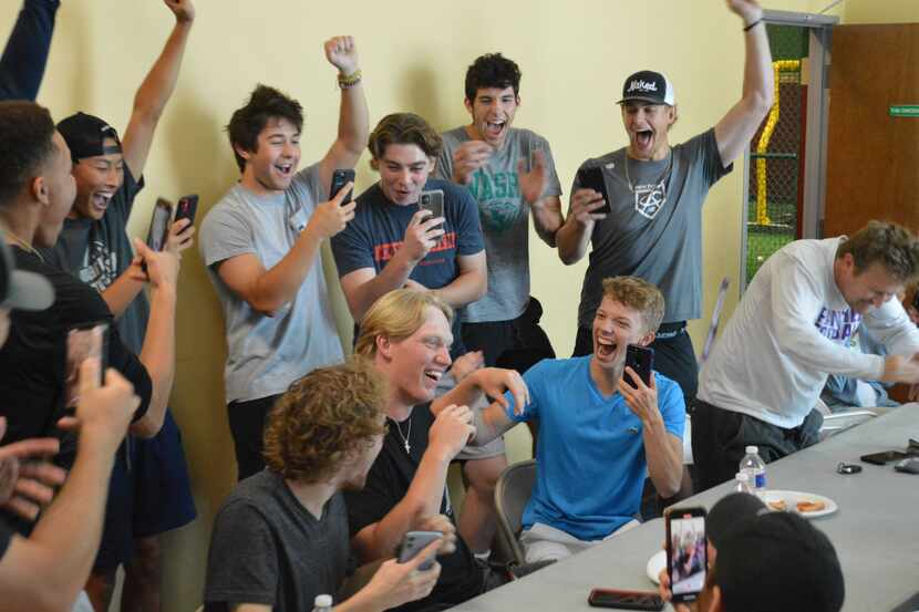 Frisco Reedy baseballer Jordan Viars celebrates with family and friends after learning of...