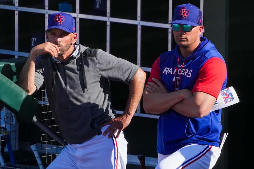 Texas Rangers manager Chris Woodward (left) and bench coach/offensive coordinator Donnie...