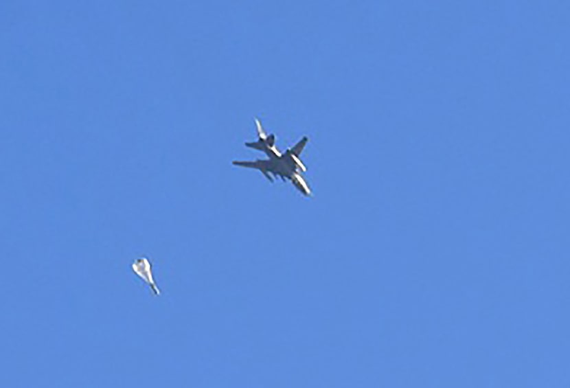 A fighter jet used by the Syrian government forces drop a bomb during their assault to...