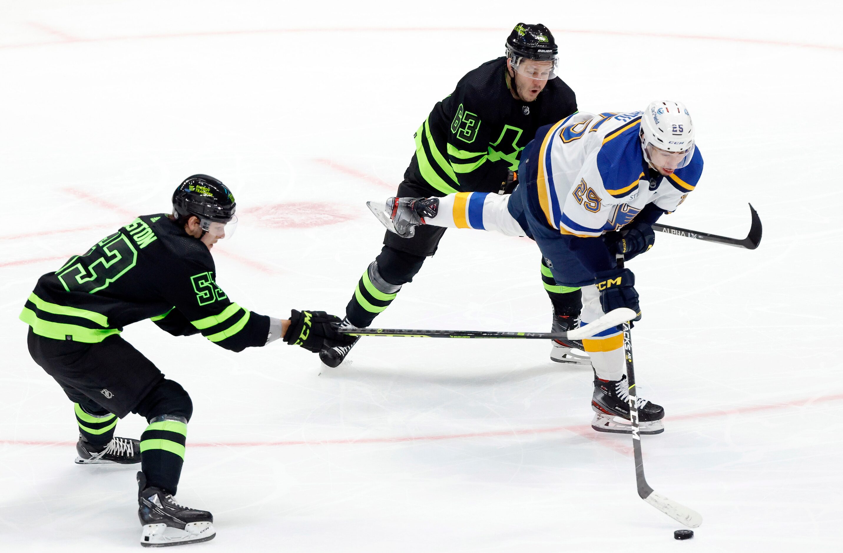 Dallas Stars right wing Evgenii Dadonov (63) and center Wyatt Johnston (53) attempt to slow...