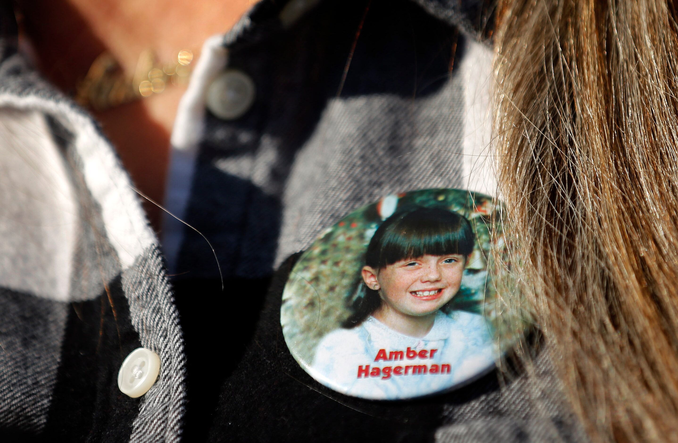 Amber Hagerman's mother Donna Williams wore a button of her daughter to a press conference...