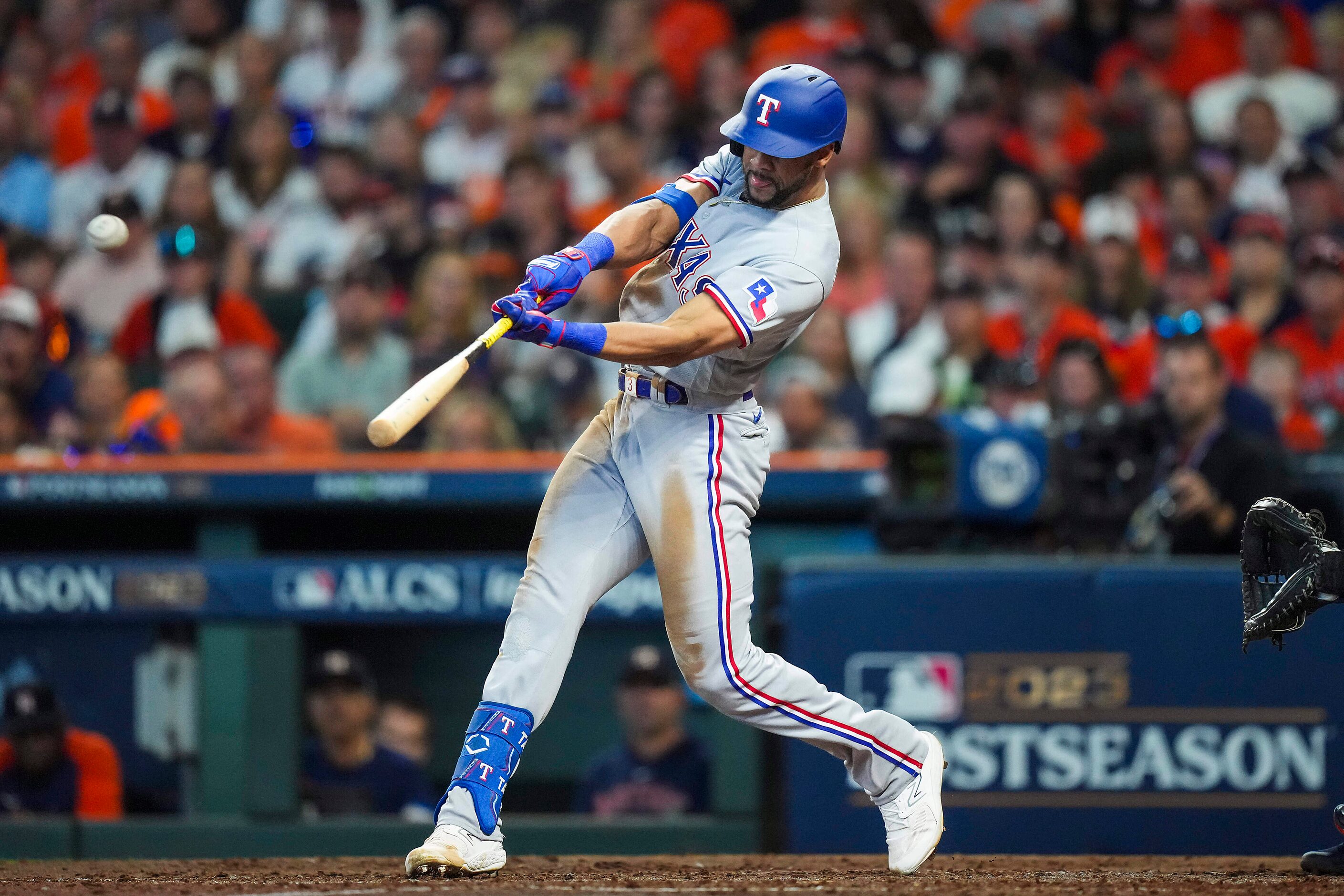 Texas Rangers center fielder Leody Taveras connects for a triple during the sixth inning in...