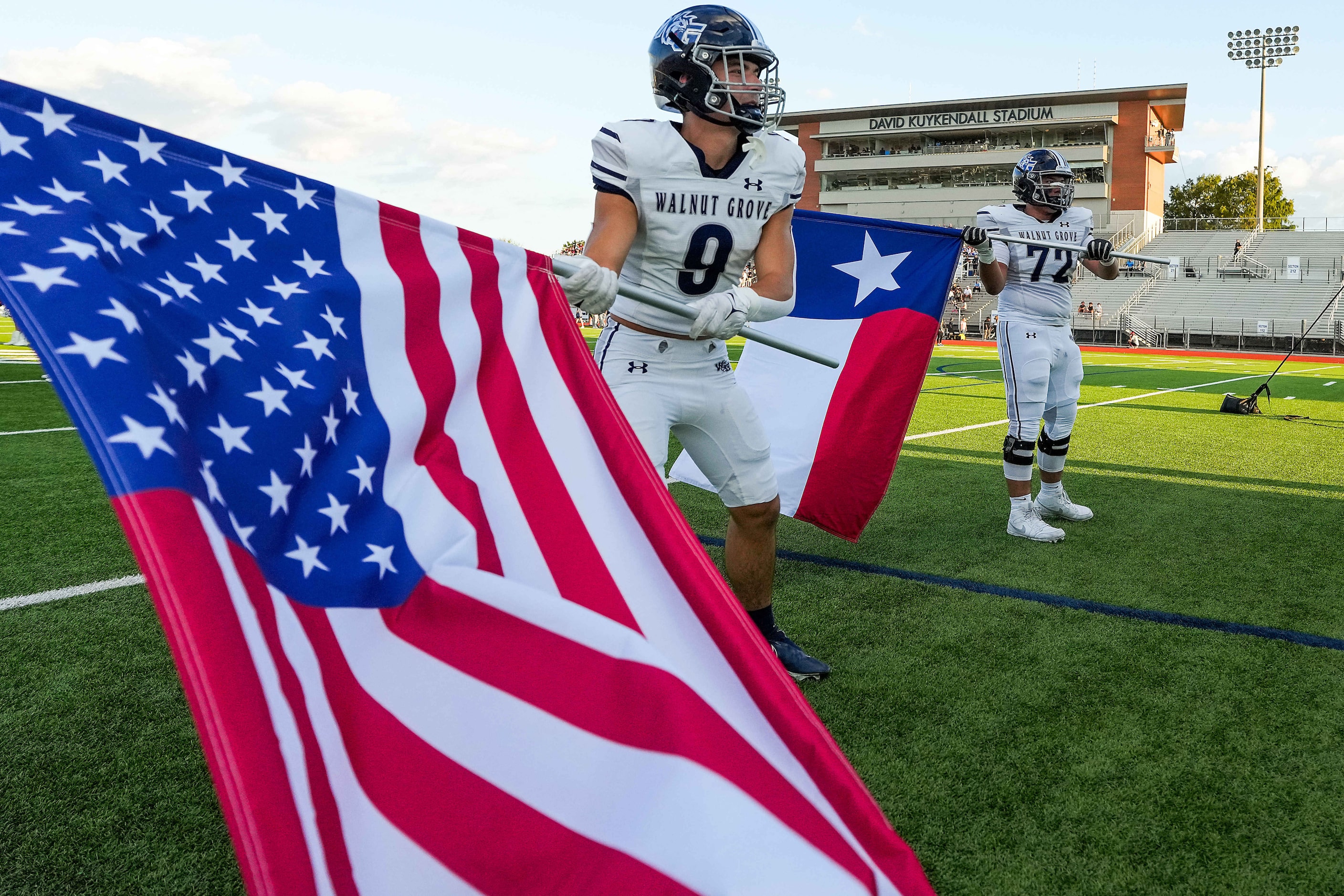 Prosper Walnut Grove linebacker Leon Krasniqi (9) and offensive lineman Nathan Hema (72)...