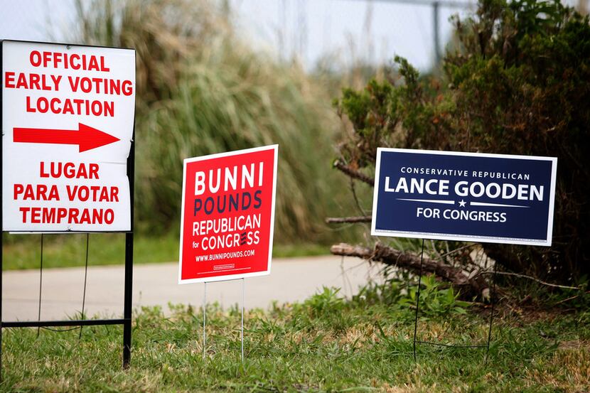Competing signs for Republican Congressional candidates Bunni Pounds and Lance Gooden stand...