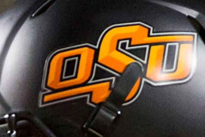 Oklahoma State football logo on a helmet.