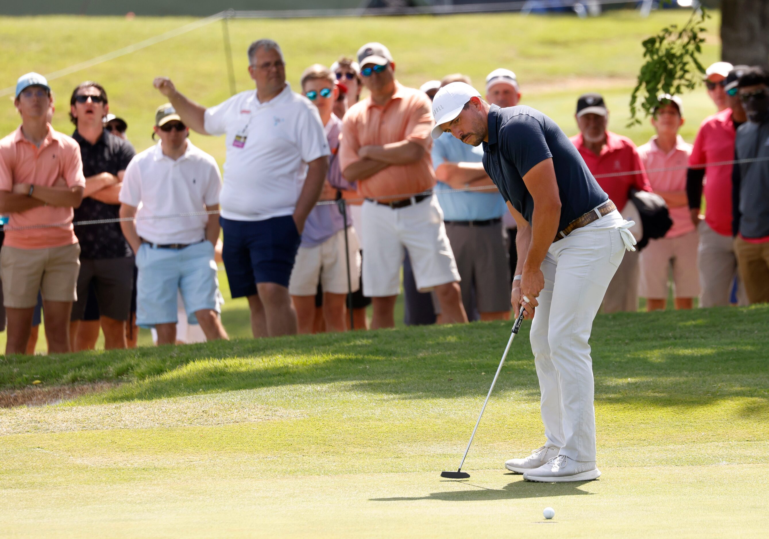 Scott Stallings watches his ball just miss on a chance for birdie on the 18th hole during...