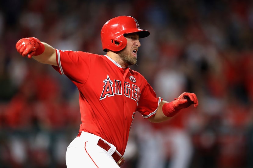 ANAHEIM, CA - AUGUST 30:  Cliff Pennington #7 of the Los Angeles Angels runs to first base...