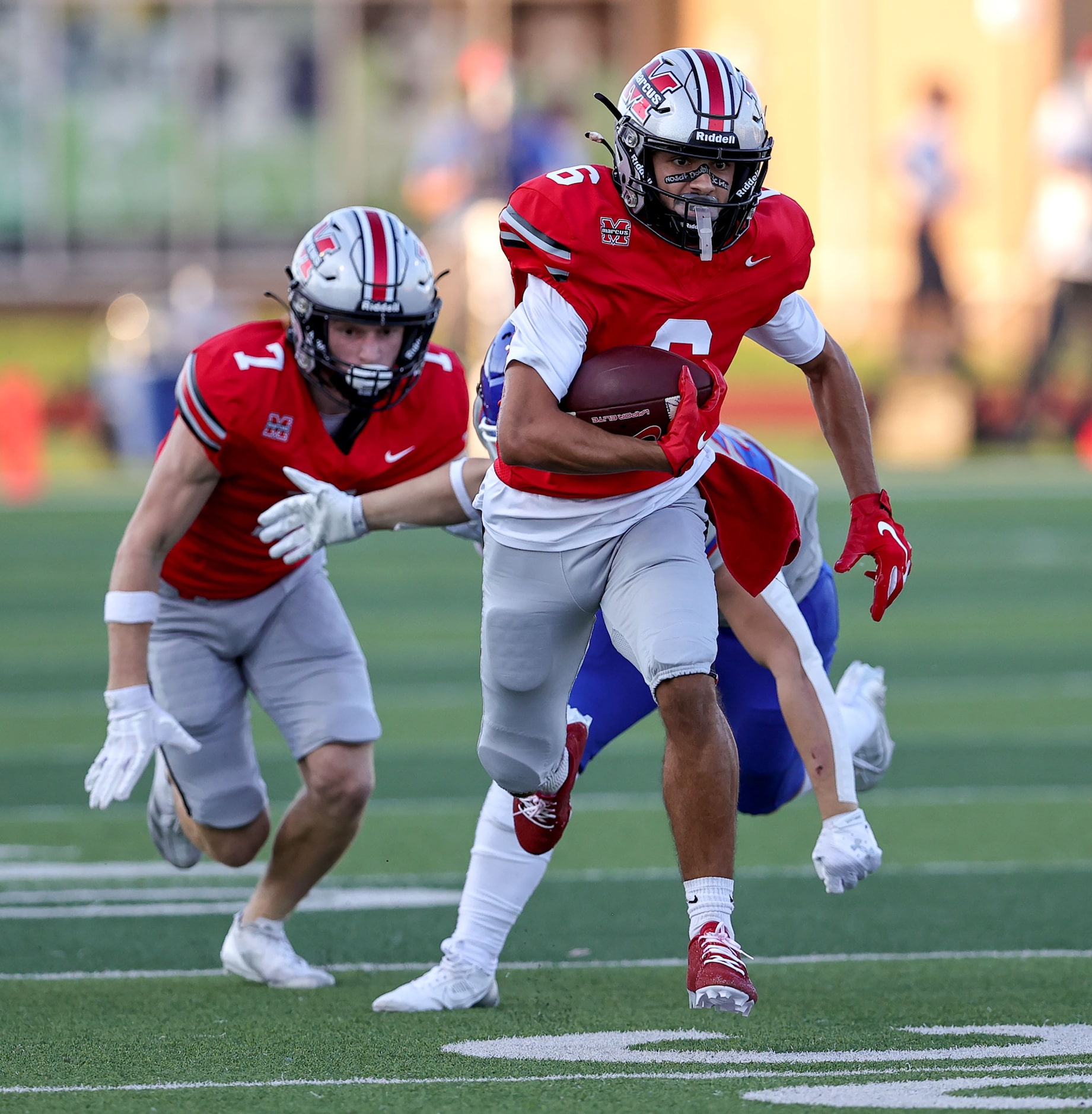 Flower Mound Marcus wide receiver Rhett Garza finds some room to run after making a...