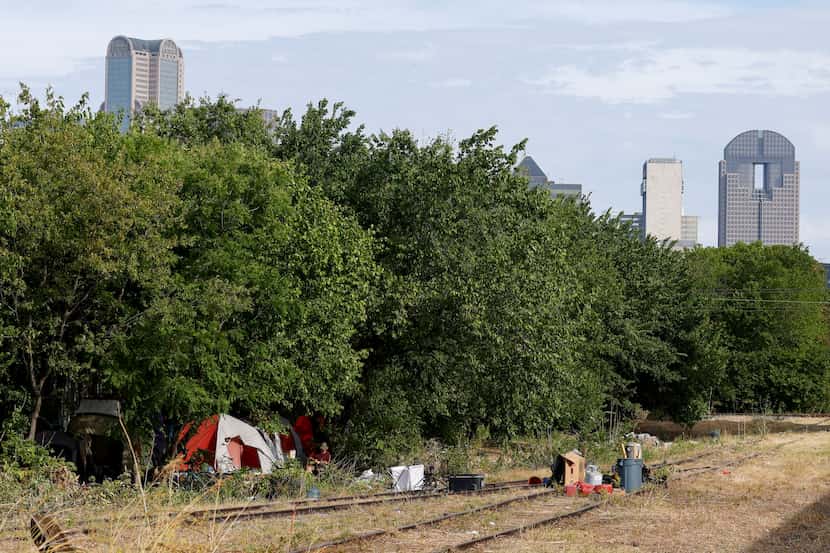 While many of the 50 or so unhoused individuals who have recently lived in this patch of...