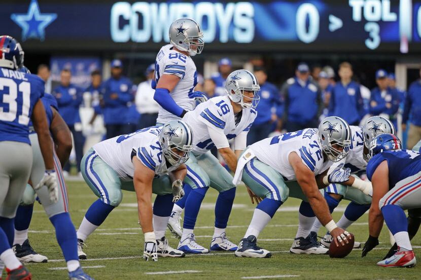 Dallas Cowboys quarterback Matt Cassel (16) calls signals under center as he leads the...