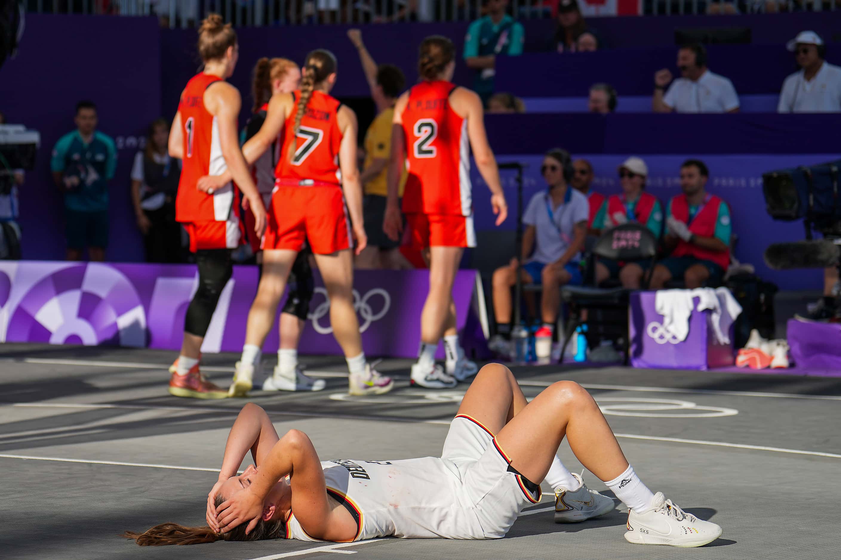 Germany’s Svenja Brunckhorst collapses to the court after a victory over Canada in a women’s...