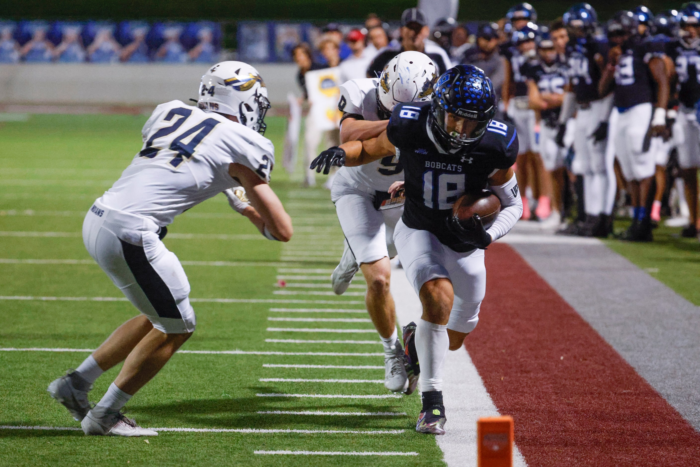 Keller High’s TJ Worthy (24) and Cole Leiker (back) tackle Byron Nelson’s Ezra Malamura (18)...