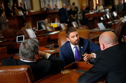 Rep. Jeff Leach, R-Plano, visits with Reps. Jonathan Stickland, R-Bedford, and Tony...